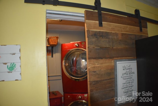 clothes washing area with stacked washer / drying machine