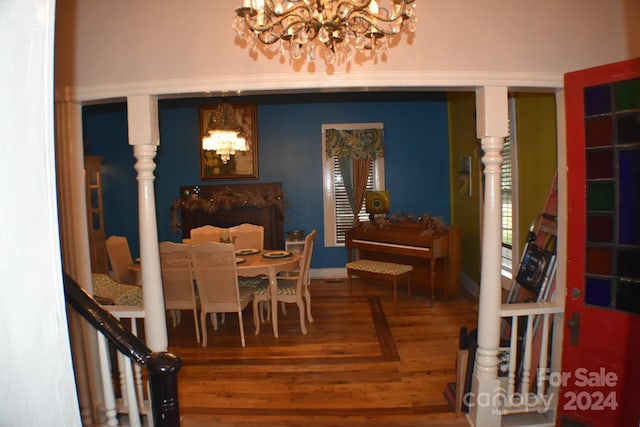 306 Mcadenville Rd, Lowell, NC 28098 - dining room with a chandelier and wood finished floors