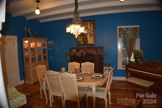 dining room with beamed ceiling, a notable chandelier, and dark wood-type flooring