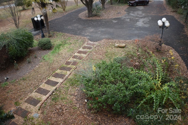 306 Mcadenville Rd, Lowell, NC 28098 - view of yard with asphalt driveway
