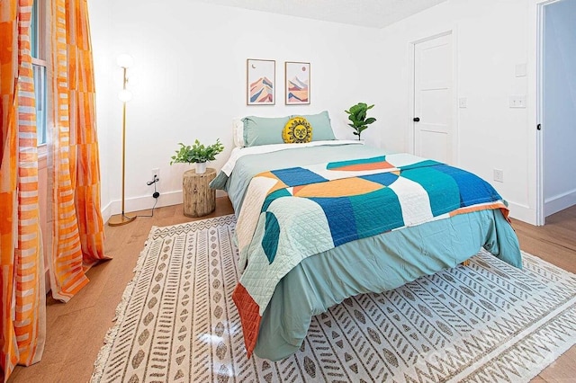 bedroom with light hardwood / wood-style floors