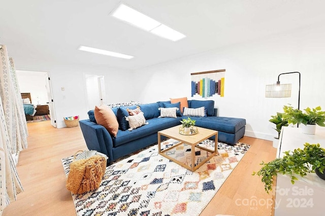 living room with light hardwood / wood-style floors