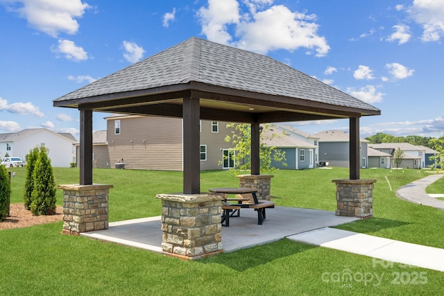 surrounding community with a gazebo, a patio, and a lawn