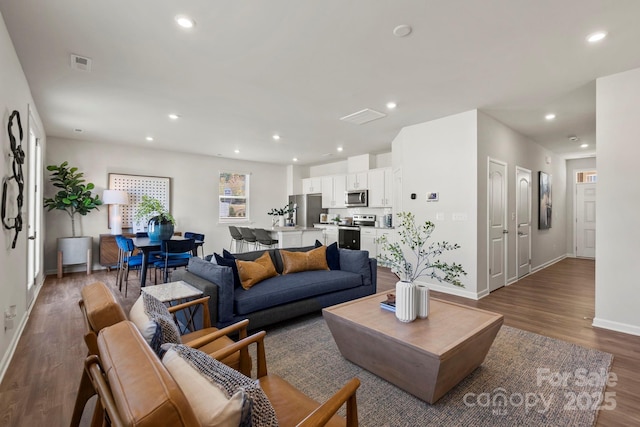 living room with dark wood-type flooring