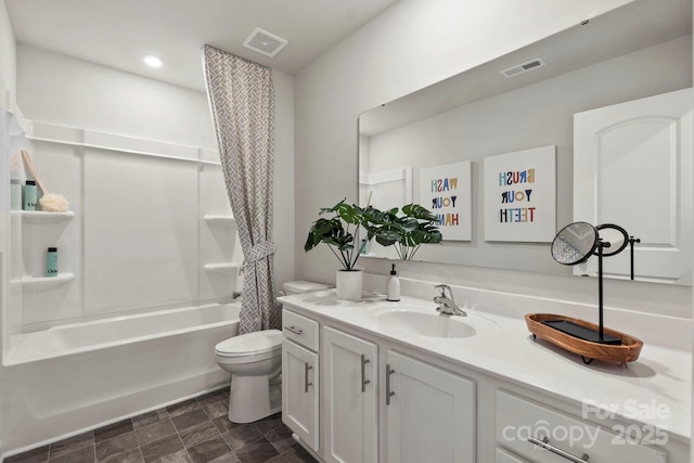 full bathroom featuring vanity, shower / tub combo, and toilet