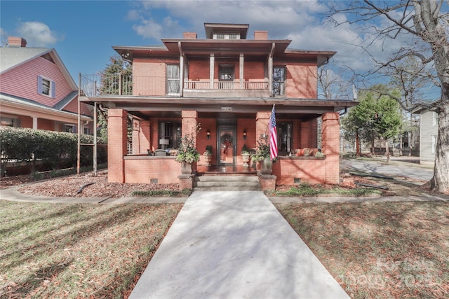 view of front of home featuring covered porch and a balcony