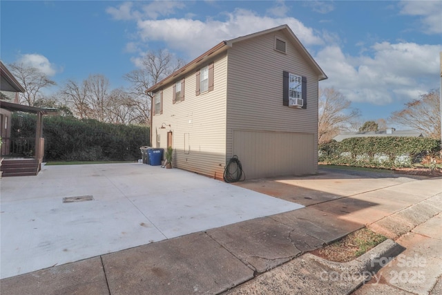 view of property exterior with a garage