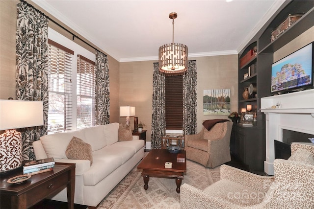 living room with ornamental molding and a chandelier