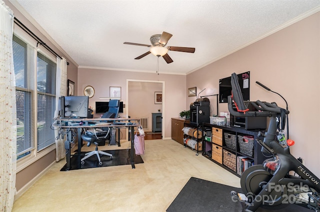 carpeted office with ceiling fan, a textured ceiling, and ornamental molding