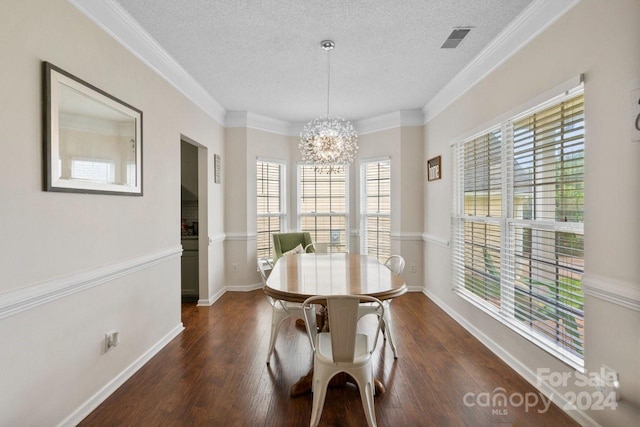 dining space with crown molding, dark wood-type flooring, a healthy amount of sunlight, and a textured ceiling