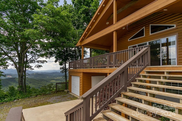 wooden terrace featuring a mountain view