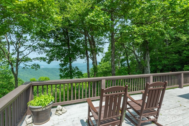 wooden deck featuring a mountain view