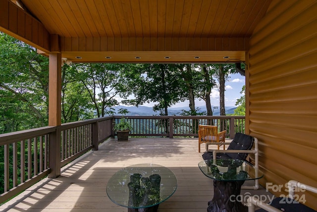 wooden terrace with a mountain view