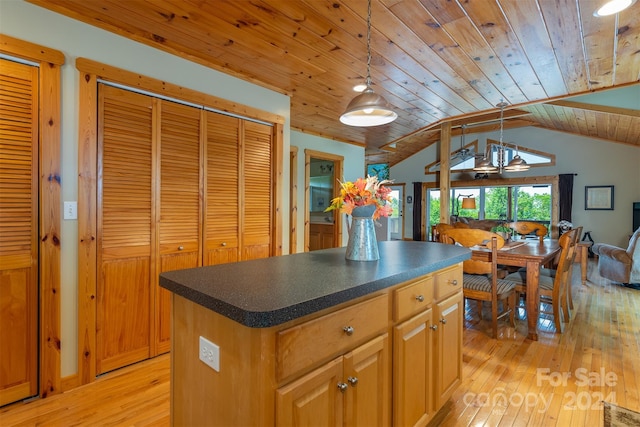 kitchen with a center island, wooden ceiling, light hardwood / wood-style flooring, pendant lighting, and vaulted ceiling