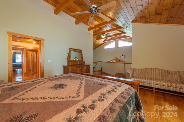 bedroom featuring multiple windows, lofted ceiling with beams, and wood ceiling