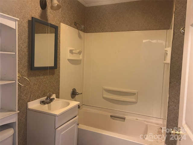 full bathroom featuring vanity,  shower combination, toilet, and crown molding