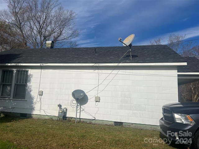 707 7th St, Spencer, NC 28159 - view of side of property with crawl space, roof with shingles, and an attached carport