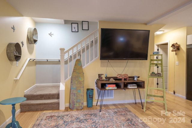 staircase featuring hardwood / wood-style flooring