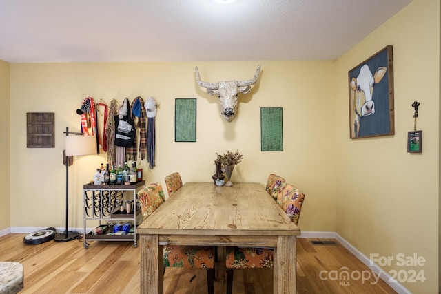 dining room with hardwood / wood-style flooring