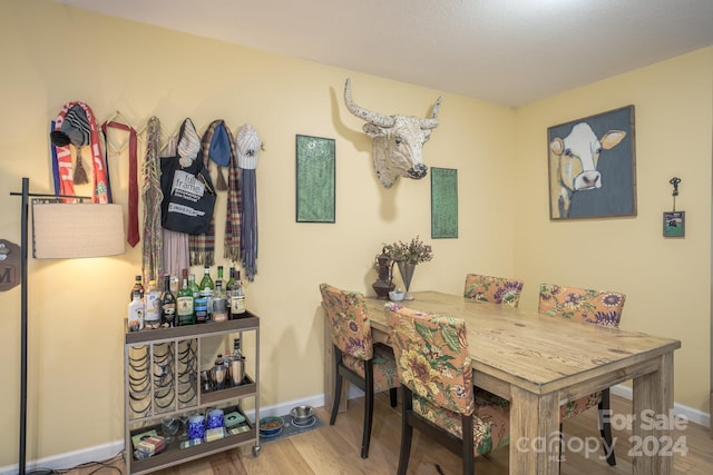 dining area with hardwood / wood-style floors