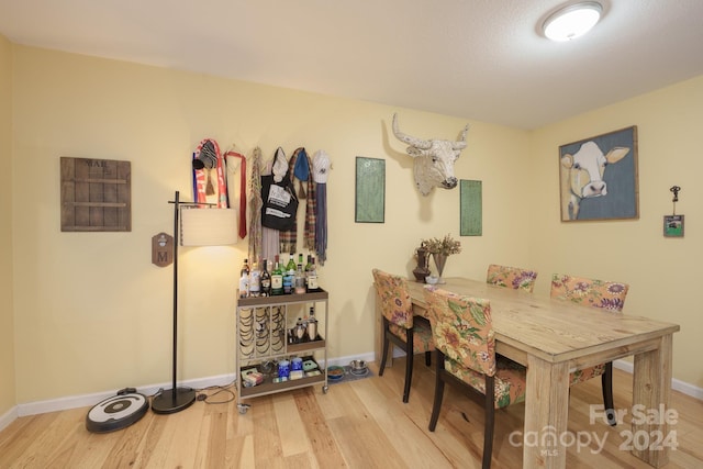 dining space featuring hardwood / wood-style floors