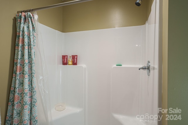 bathroom featuring walk in shower