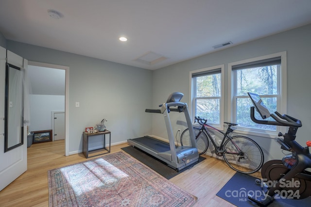 exercise area with light wood-type flooring