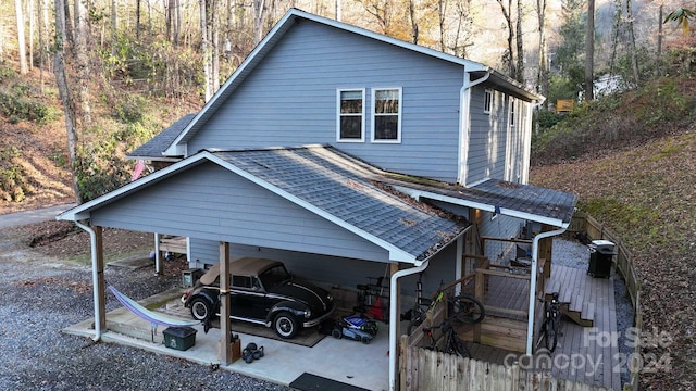 view of property exterior with a carport