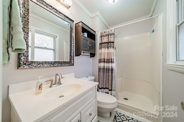 bathroom with a shower with curtain, vanity, toilet, and crown molding