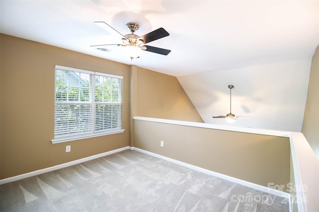 unfurnished room with light carpet, ceiling fan, and lofted ceiling