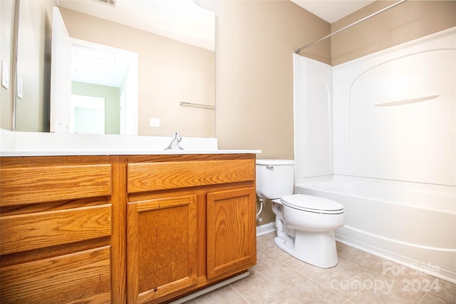 full bathroom with shower / washtub combination, tile patterned flooring, vanity, and toilet