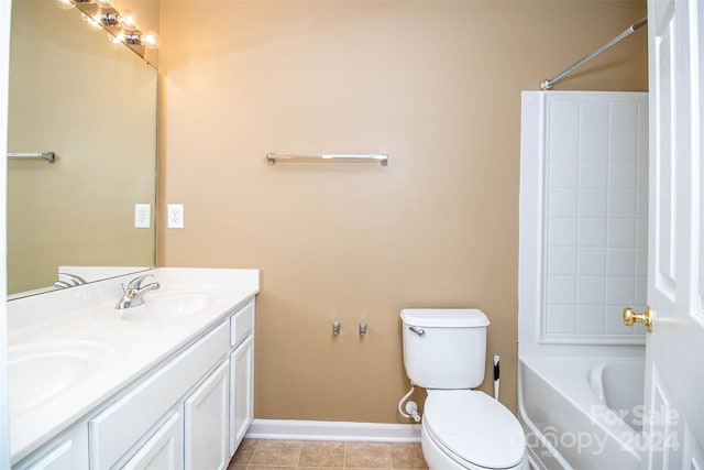 full bathroom featuring tile patterned floors, bathing tub / shower combination, vanity, and toilet