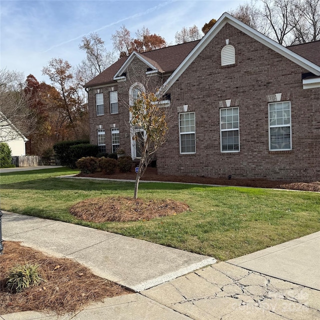 view of front of home with a front lawn