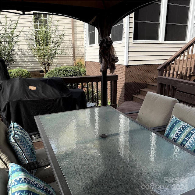 wooden deck featuring grilling area