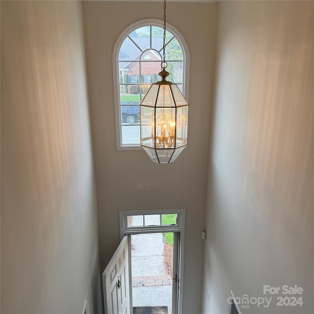 entrance foyer featuring an inviting chandelier