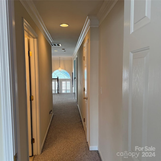 hall with light carpet and crown molding