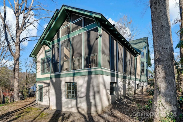 view of home's exterior featuring a sunroom