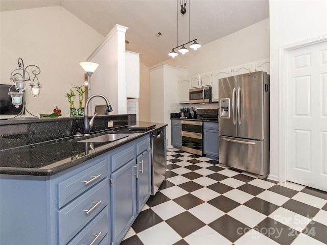 kitchen with sink, blue cabinetry, decorative light fixtures, white cabinetry, and stainless steel appliances