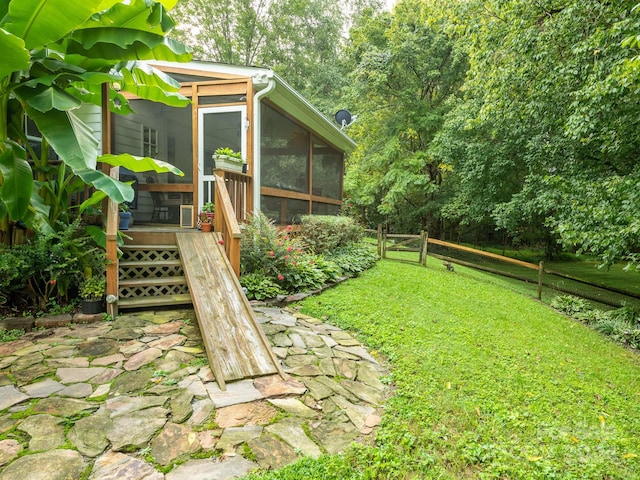 view of yard featuring a sunroom