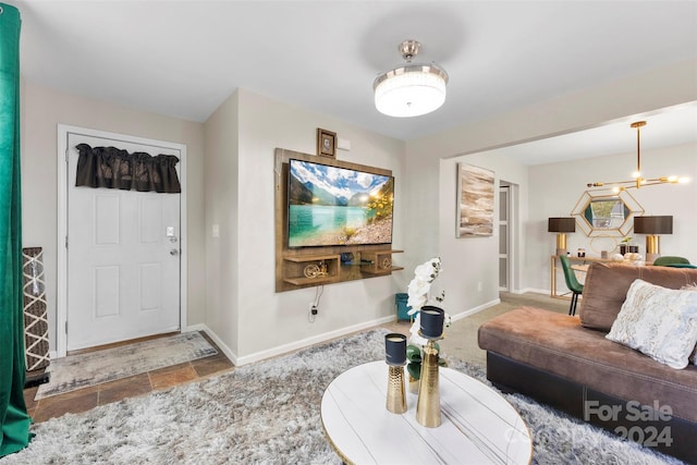 living room featuring a chandelier