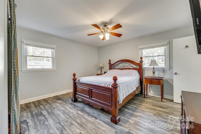 bedroom featuring ceiling fan and dark hardwood / wood-style flooring