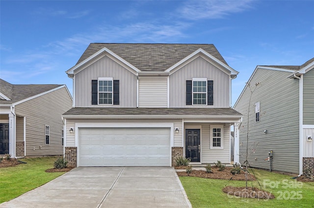 view of front of house featuring a garage and a front yard