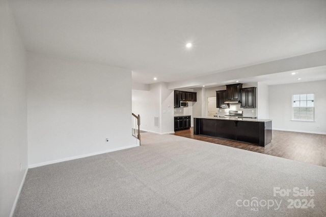 unfurnished living room featuring dark wood-type flooring