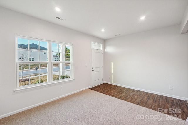 unfurnished room featuring dark hardwood / wood-style floors