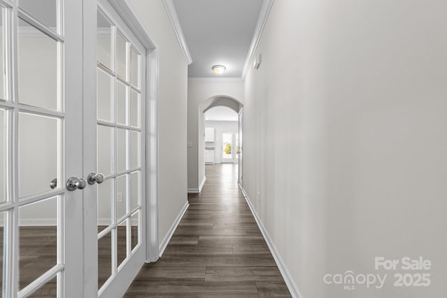 hall featuring dark hardwood / wood-style flooring and crown molding