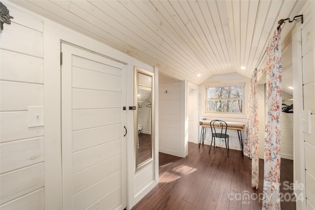 corridor featuring vaulted ceiling, dark wood-type flooring, and wood ceiling