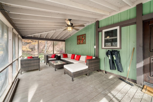 sunroom with vaulted ceiling with beams and a baseboard radiator