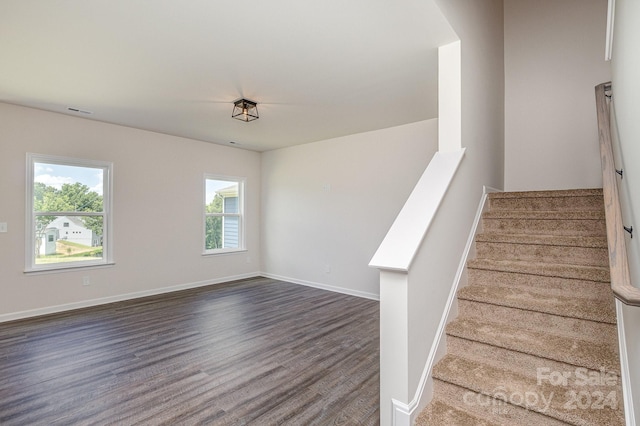 stairway with wood-type flooring