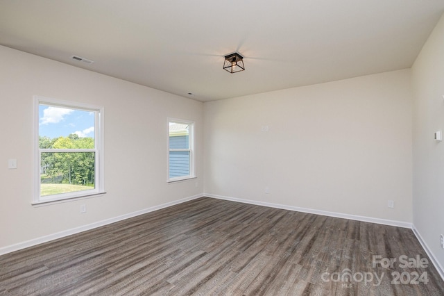 empty room featuring dark hardwood / wood-style floors