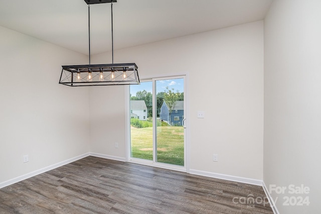 unfurnished dining area with wood-type flooring